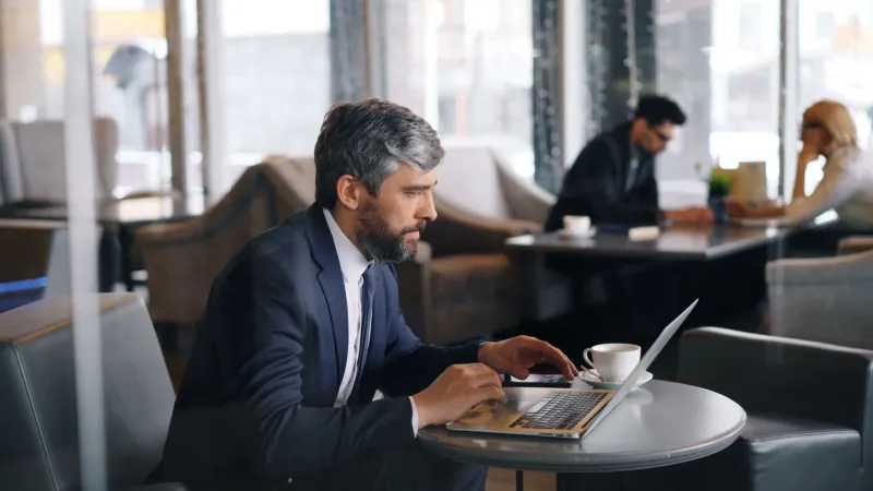 Laptop Land: Navigating the Silent Social Contract of Your Coffee Shop's Communal Table